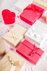Valentines day gifts boxes background, frame for holiday greeting card background, with confetti  candy hearts, flat lay, top view, copy space
