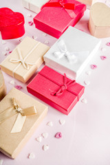 Valentines day gifts boxes background, frame for holiday greeting card background, with confetti  candy hearts, flat lay, top view, copy space