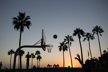 Basketball match on venice beach.