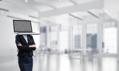 Business woman with laptop instead of head.