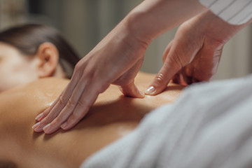 Woman Enjoying a Back Massage .