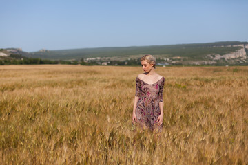 a woman farmer in field of wheat harvest