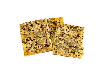 Isolate of three cookies on a white background. Dietary cereal biscuits, lean with sesame, sunflower, flax seeds.