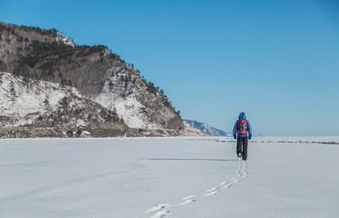 Fototapeta na wymiar Man hiking on ice. Winter Landscape.