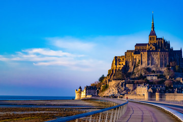 Medieval castle, against the blue sky and white clouds, the castle on the island, the castle is...
