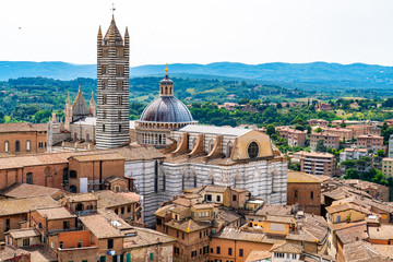 Fototapeta premium Aerial view of Siena Cathedral and the cityscape of Siena