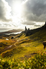 Old Man of Storr as seen from a high point on a sunny autumn day and sun covered clouds (Isle of...