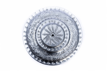 Close up of white or silver colored shiny container isolated on white.