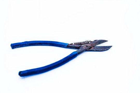 Close up of pilers isolated on white with a blue colored handle.