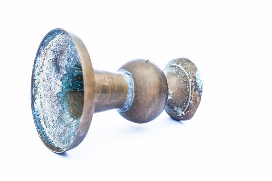 Close up of old ancient vessel or utensil or container or isolated on white i.e. Chilamchi or chelam or spit container or spittoon or brass spit container isolated on white.