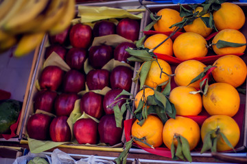 Colorful organic fruits in the marketplace. Bright summer background. Healthy food. Natural nutrition for diet.
