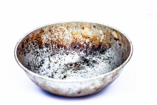 Close up of silver colored empty woks or rounded pan or karahi or kadahi isolated on white widely used in Asia for frying purposes.