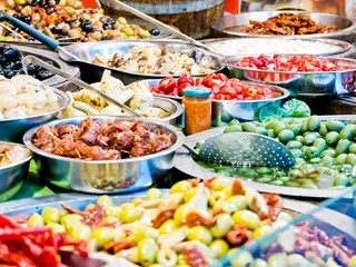 Close up of several baskets of Tarallucci with spices, like Saffron. Savory biscuits typical of southern Italy. Horizontal view