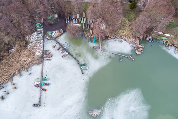 frozen lake with wooden pier