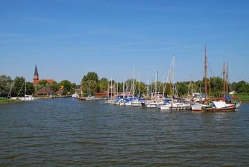 Harbor and church in Wustrow. Wustrow is a municipality at Baltic Sea coast in Mecklenburg-Vorpommern, Fischland, Germany