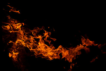 Fire flames on Abstract art black background, Burning red hot sparks rise from large, Fiery orange glowing