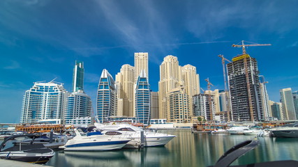 Fototapeta na wymiar Timelapse hyperlapse of business city in Dubai marina at waterfront