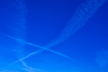 Blue sky background with a tiny clouds. Sunny day