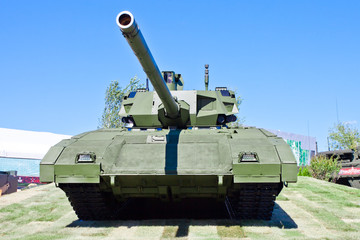  T-14 Armata tank at the military exhibition. Proud tank against the sky.