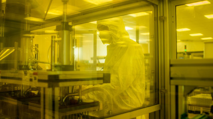 In Manufacturing Facility Shot of Scientist in Sterile Protective Clothing Work on Industrial 3D...