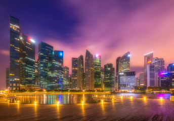 Fototapeta na wymiar The Central Business District (CBD) Buildings around the Marina Bay in Singapore at dawn.