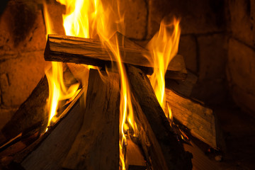 Wood burning in a cozy fireplace at home, keep warm