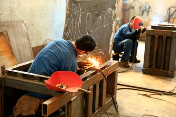 workers work in the workshop of the factory,