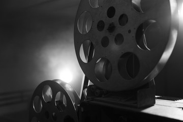 Vintage movie projector. Film reels. Black and white. Still life, close-up