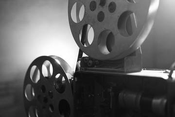 Vintage movie projector. Film reels. Black and white. Still life, close-up