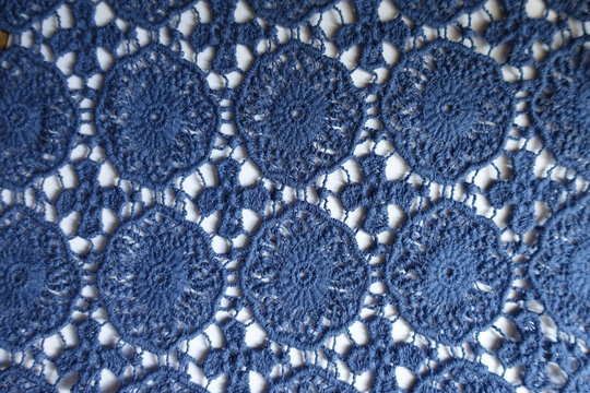 Top view of blue  lace on white background
