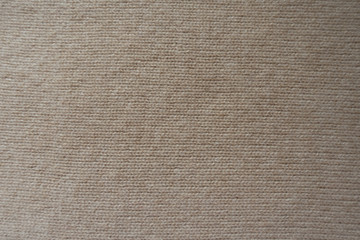 Fototapeta na wymiar Backdrop - simple beige knitted fabric from above
