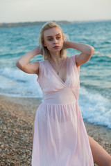Fototapeta na wymiar beautiful fashionable woman in bathing suit on the Beach Ocean