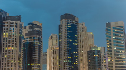 Fototapeta na wymiar Towers of Dubai Marina in Dubai day to night timelapse