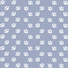 white cats paw on an lilac background