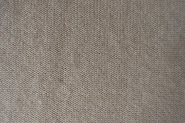 Top view of wrong side of beige knitted fabric