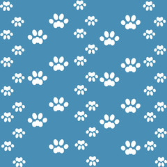 Fototapeta na wymiar white cats paw on an blue background