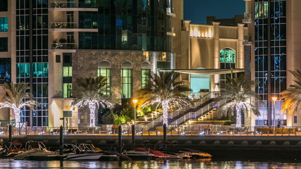 Fototapeta premium Promenade in Dubai Marina timelapse at night, UAE.