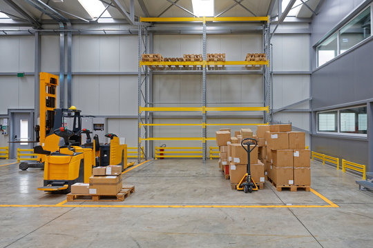 Forklift and Pallet Truck in Warehouse