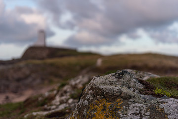 Fototapeta premium The Llanddwyn island lighthouse, Twr Mawr at Ynys Llanddwyn on Anglesey, North Wales.