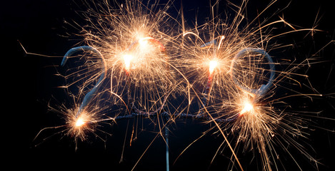 Sparkler isolated on black, 2019