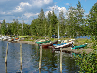 Fototapeta na wymiar Landscape of the boats parked on the lake at summer
