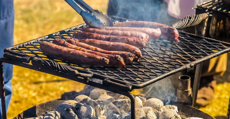 BBQ sausage on an open coal fire grill