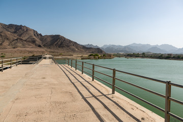 Fototapeta na wymiar Reservoir and dam in Hatta, an enclave of Dubai in the Hajar Mountains, United Arab Emirates