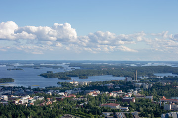 Obraz premium Landscape of Kuopio from a tower in a sunny day at summer full of nature