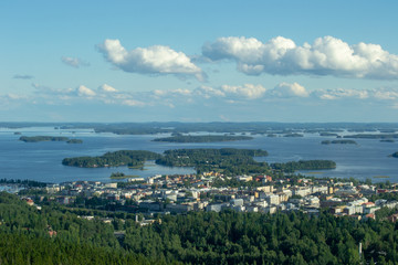 Fototapeta premium Landscape of Kuopio from a tower in a sunny day at summer full of nature