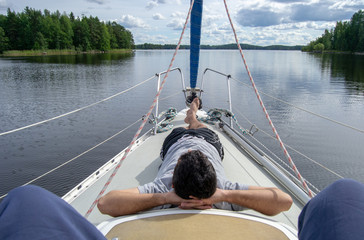 guy landing on a boat relaxing in Kuopio