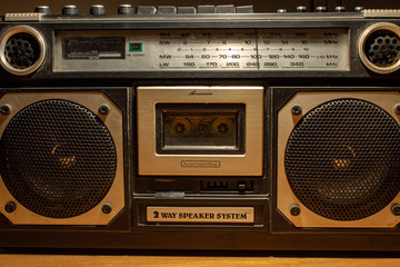 In the 70s and 80s the music was listened to through the cassettes, a magnetic storage device. The radios were very large, containing two speakers and a cassette player.