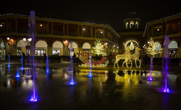 MILAN, ITALY, DECEMBER 21, 2018 - Shopping center "Serravalle Outlet" on Christmas days by night, near Milan, Italy
