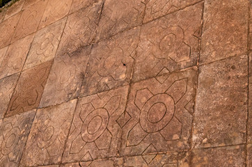 Fototapeta premium Texture of ancient graven tiles on the floor in San Ignacio ruins, Misiones, Argentina
