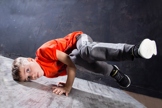 Young russian bboy doing some stunts on the stage